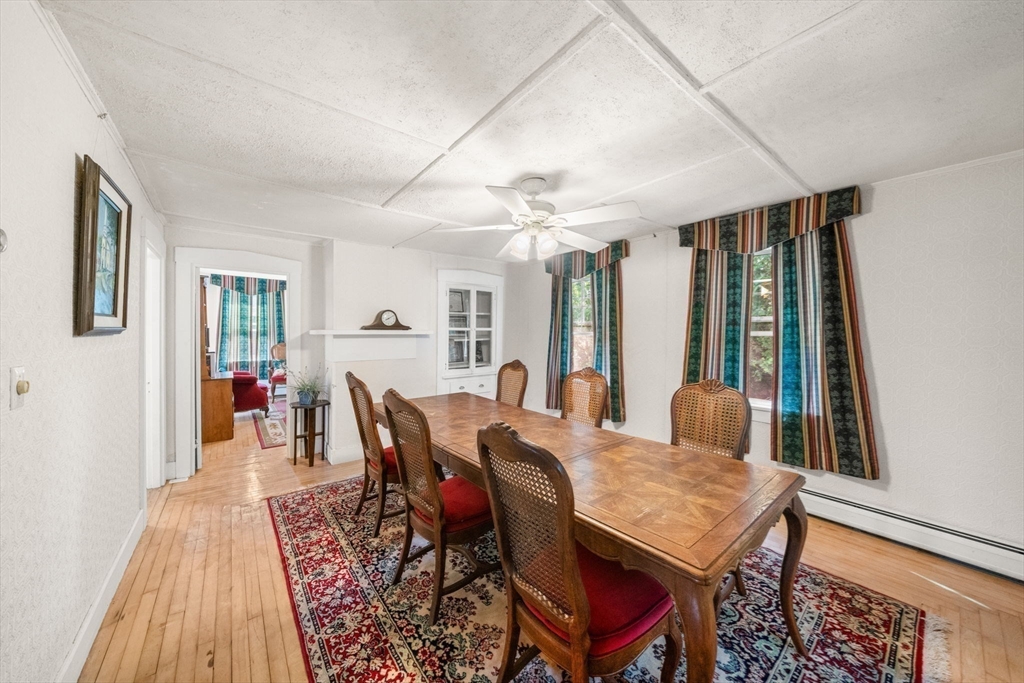 1406 Tucker Road Dartmouth, MA 02747 - Photo 15 of 30 a view of a dining room with furniture window and wooden floor