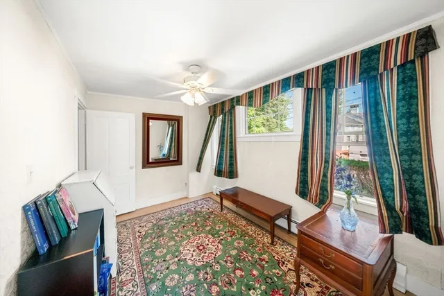 a living room with large window and a couch