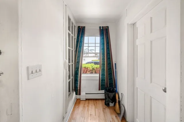 an empty room with a rug