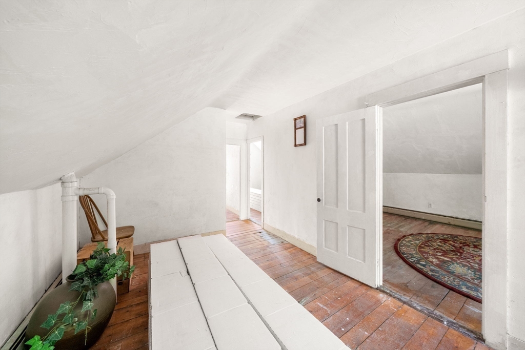 1406 Tucker Road Dartmouth, MA 02747 - Photo 25 of 30 a bedroom with a bed and a painting on the wall