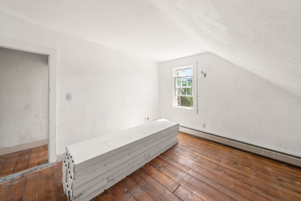 1406 Tucker Road Dartmouth, MA 02747 - Photo 27 of 30 a view of a room with wooden floor and window
