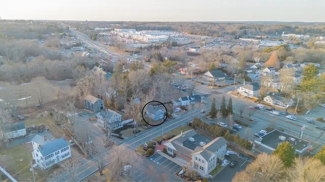 an aerial view of a house with a yard
