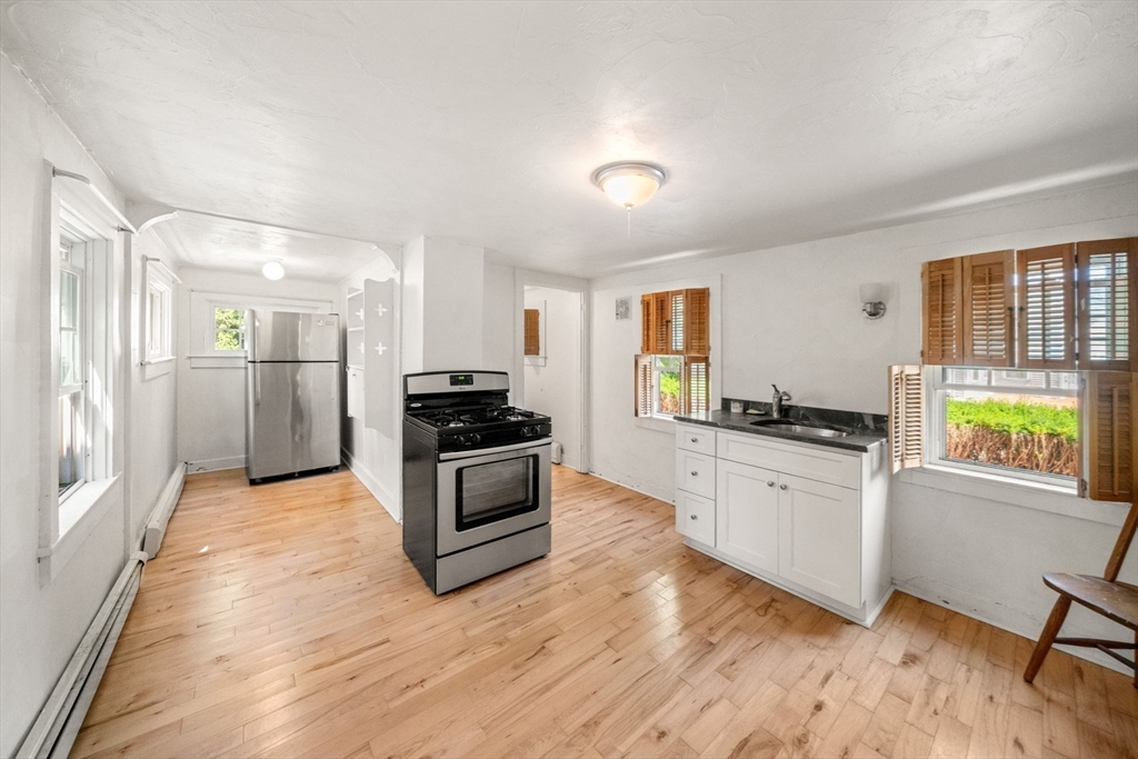 1406 Tucker Road Dartmouth, MA 02747 - Photo 9 of 30 a kitchen with stainless steel appliances granite countertop a stove and a refrigerator