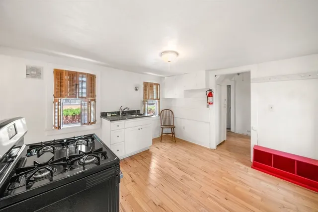 a kitchen with a stove and a refrigerator