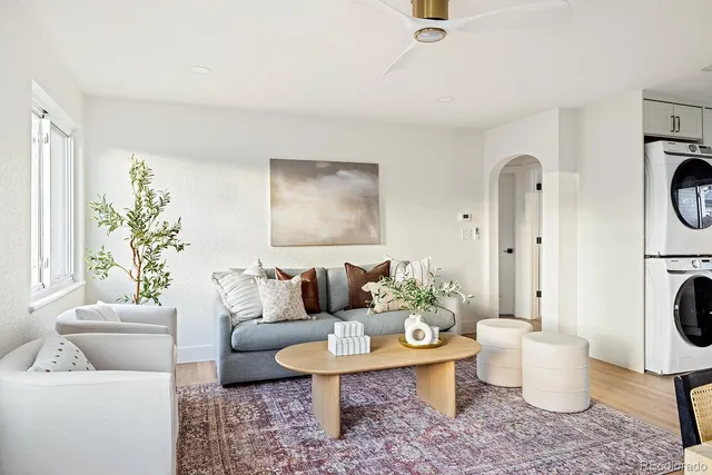 a living room with furniture and a table