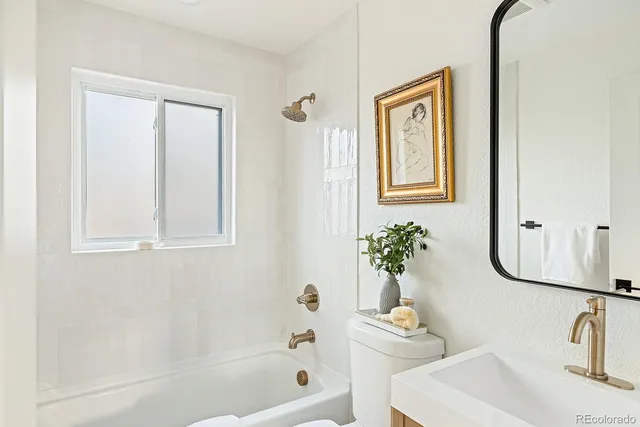 a bath room with a sink and a mirror