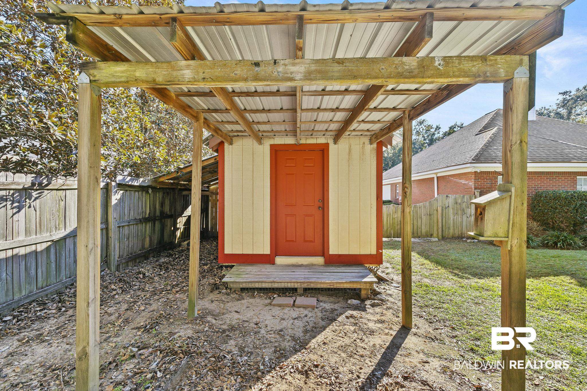 9631 Bay Meadows Avenue Fairhope, AL 36532 - Photo 34 of 49 View of outdoor structure with covered back area and lawn.