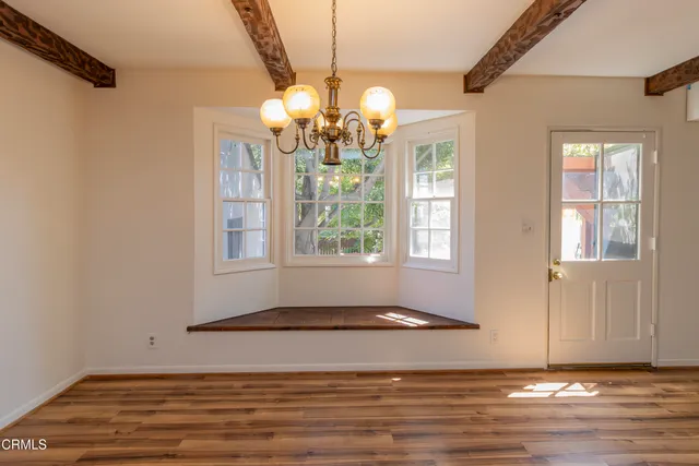 a view of a livingroom with wooden floor