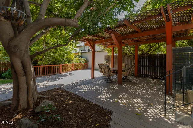 a view of a bench in the backyard