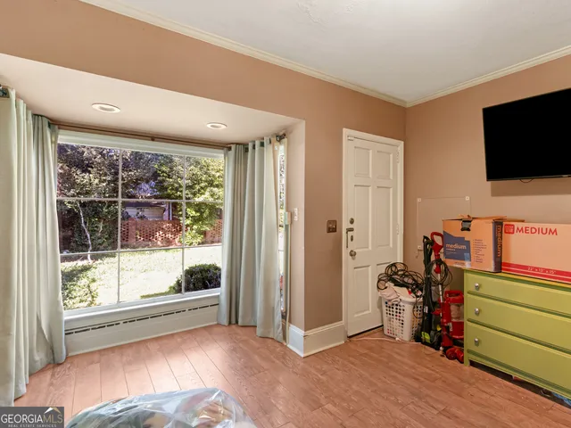 a view of a livingroom with furniture and a flat screen tv