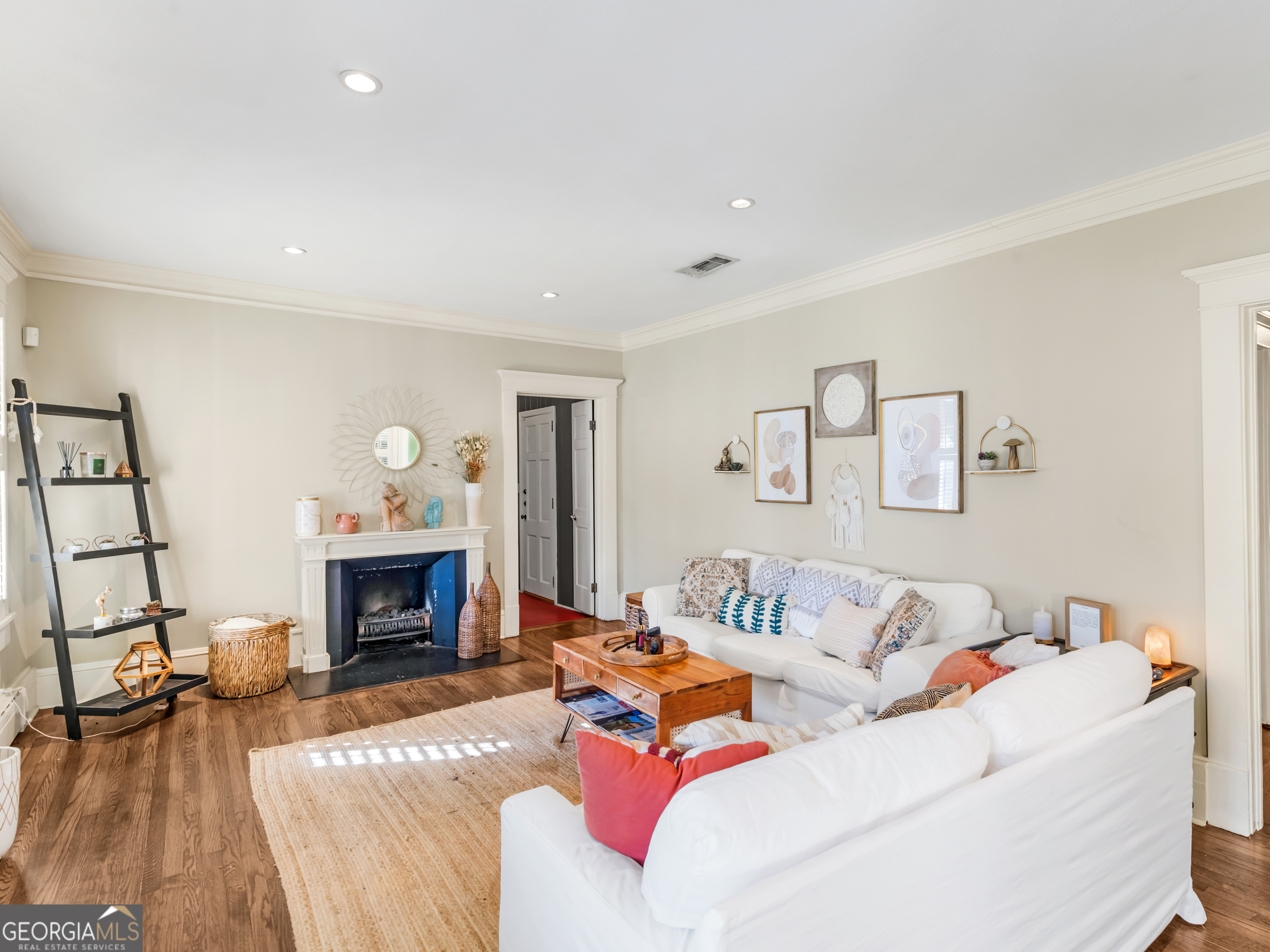 192 Corbin Avenue Macon, GA 31204 - Photo 3 of 35 a living room with furniture a fireplace with wooden floor