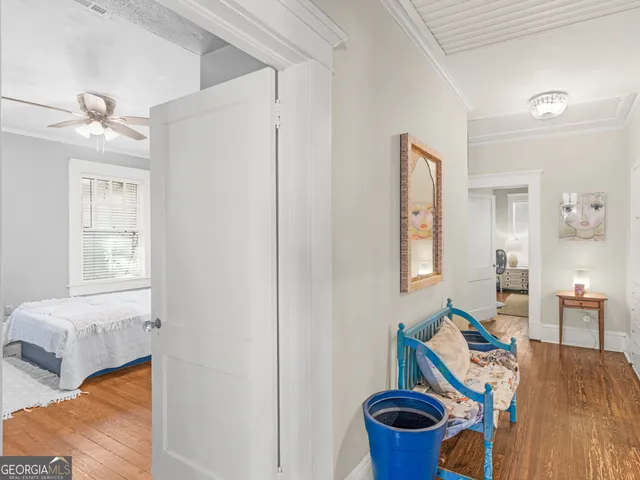 a room with furniture and wooden floor