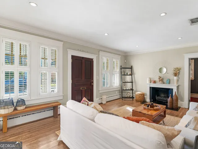 a bedroom with furniture and a fireplace