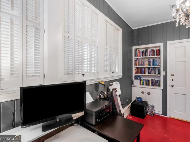 a view of a livingroom with furniture and a window