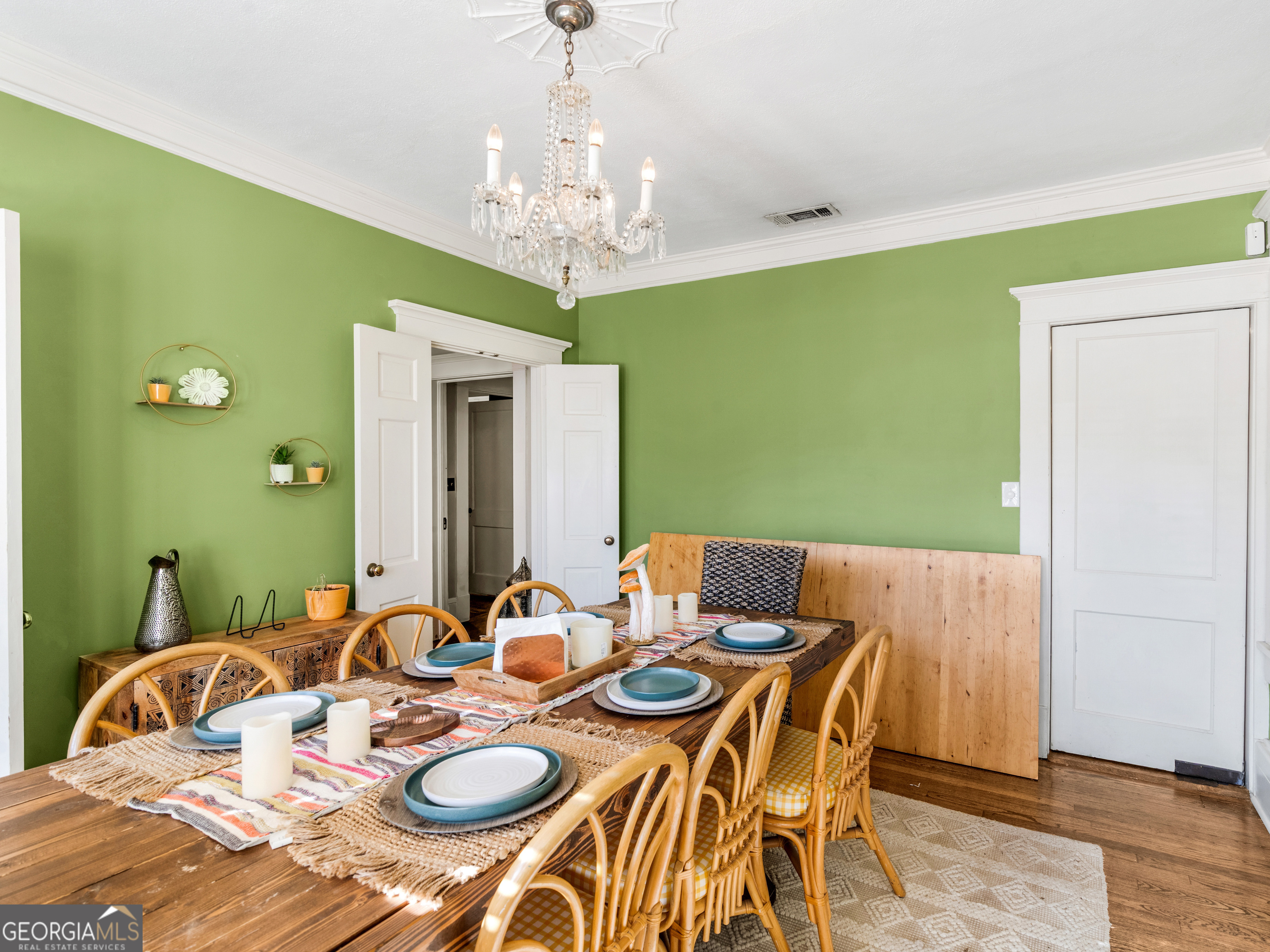 192 Corbin Avenue Macon, GA 31204 - Photo 9 of 35 a view of a dining room with furniture a chandelier and wooden floor