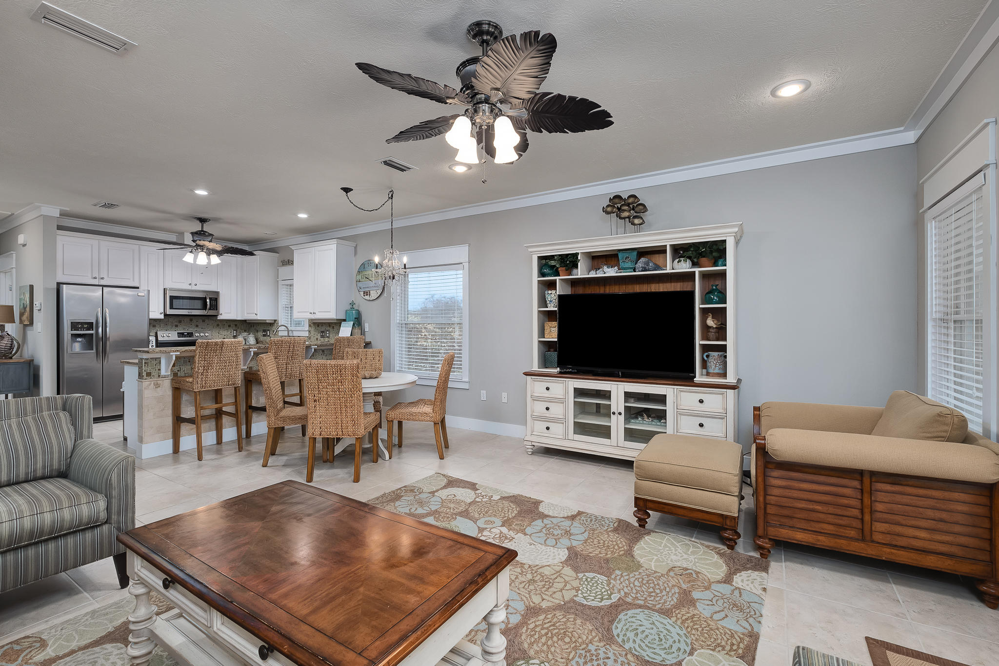 8968 East County Highway 30A Inlet Beach, FL 32461 - Photo 12 of 46 a living room with furniture kitchen view and a flat screen tv
