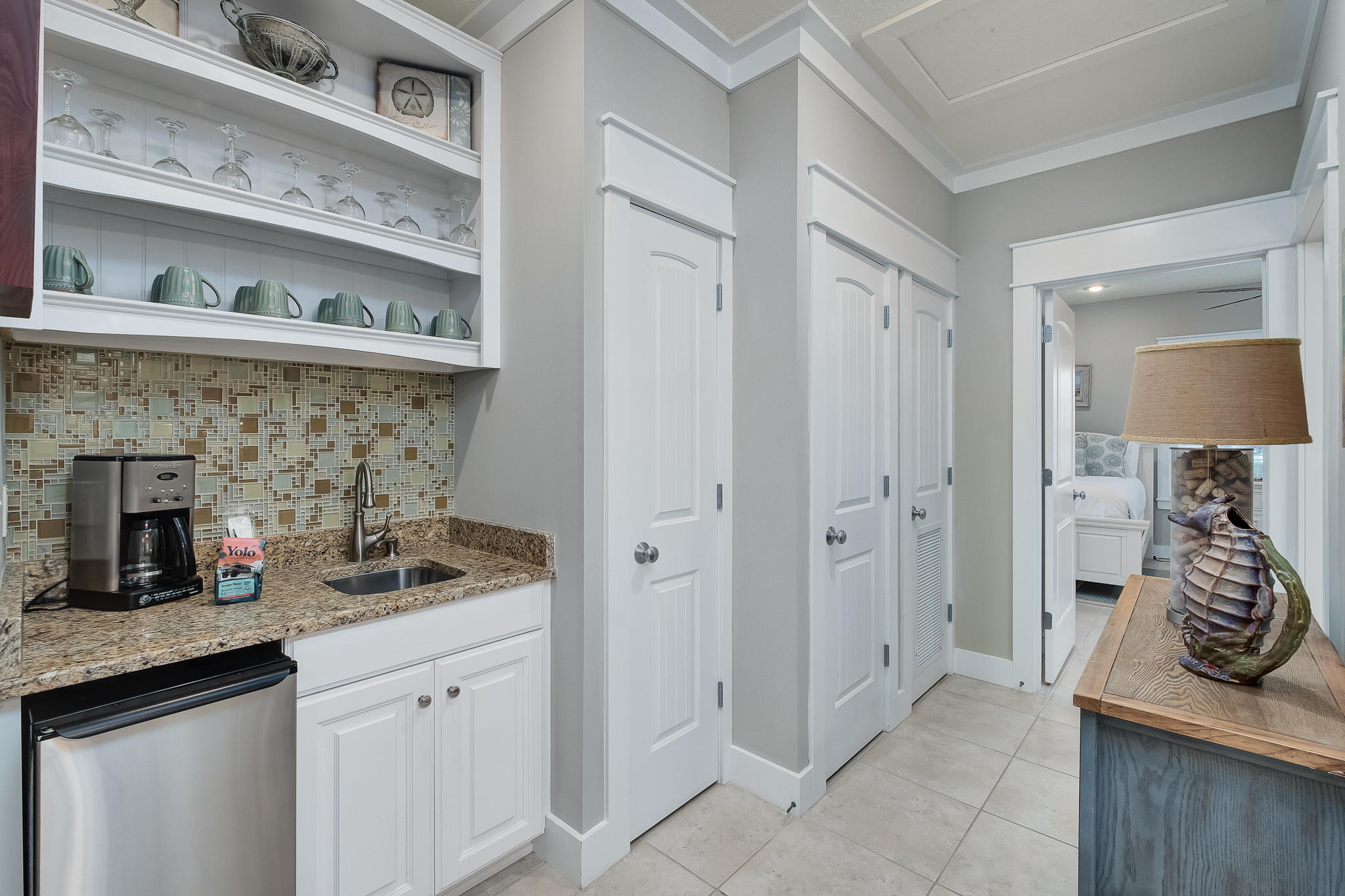 8968 East County Highway 30A Inlet Beach, FL 32461 - Photo 16 of 46 a kitchen with stainless steel appliances granite countertop a refrigerator and a sink