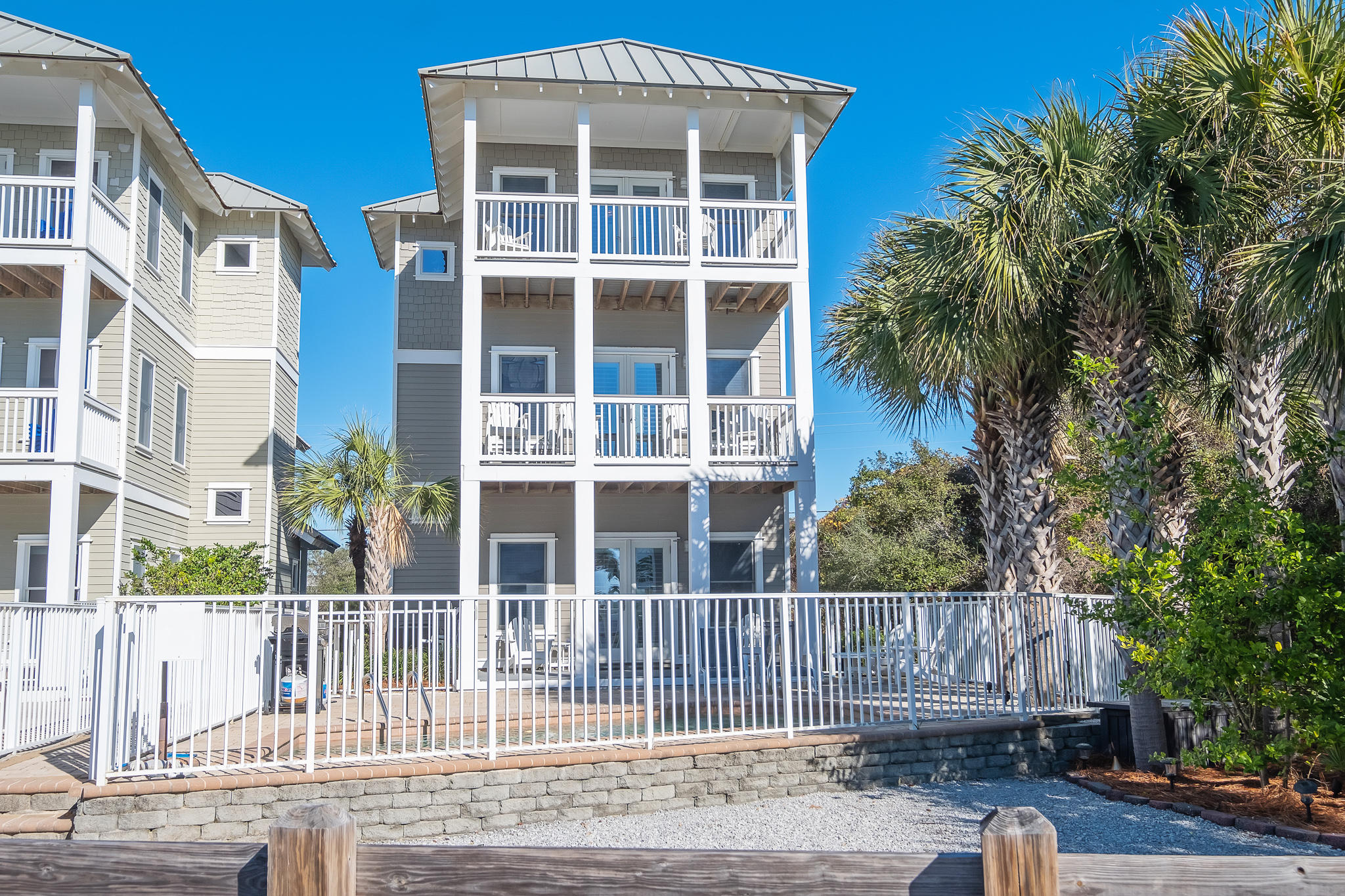8968 East County Highway 30A Inlet Beach, FL 32461 - Photo 35 of 46 a view of a brick house with a yard and large tree