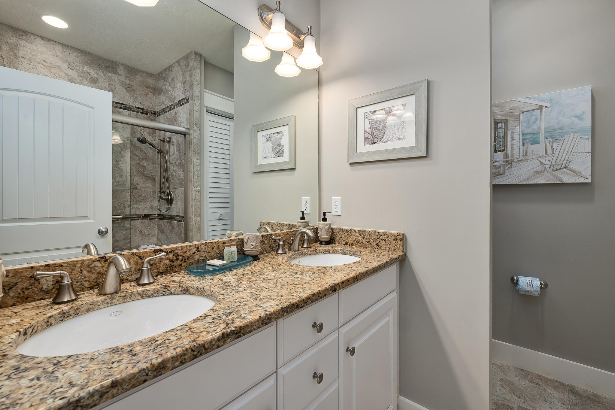 8968 East County Highway 30A Inlet Beach, FL 32461 - Photo 4 of 46 a bathroom with a granite countertop double vanity sink and a mirror