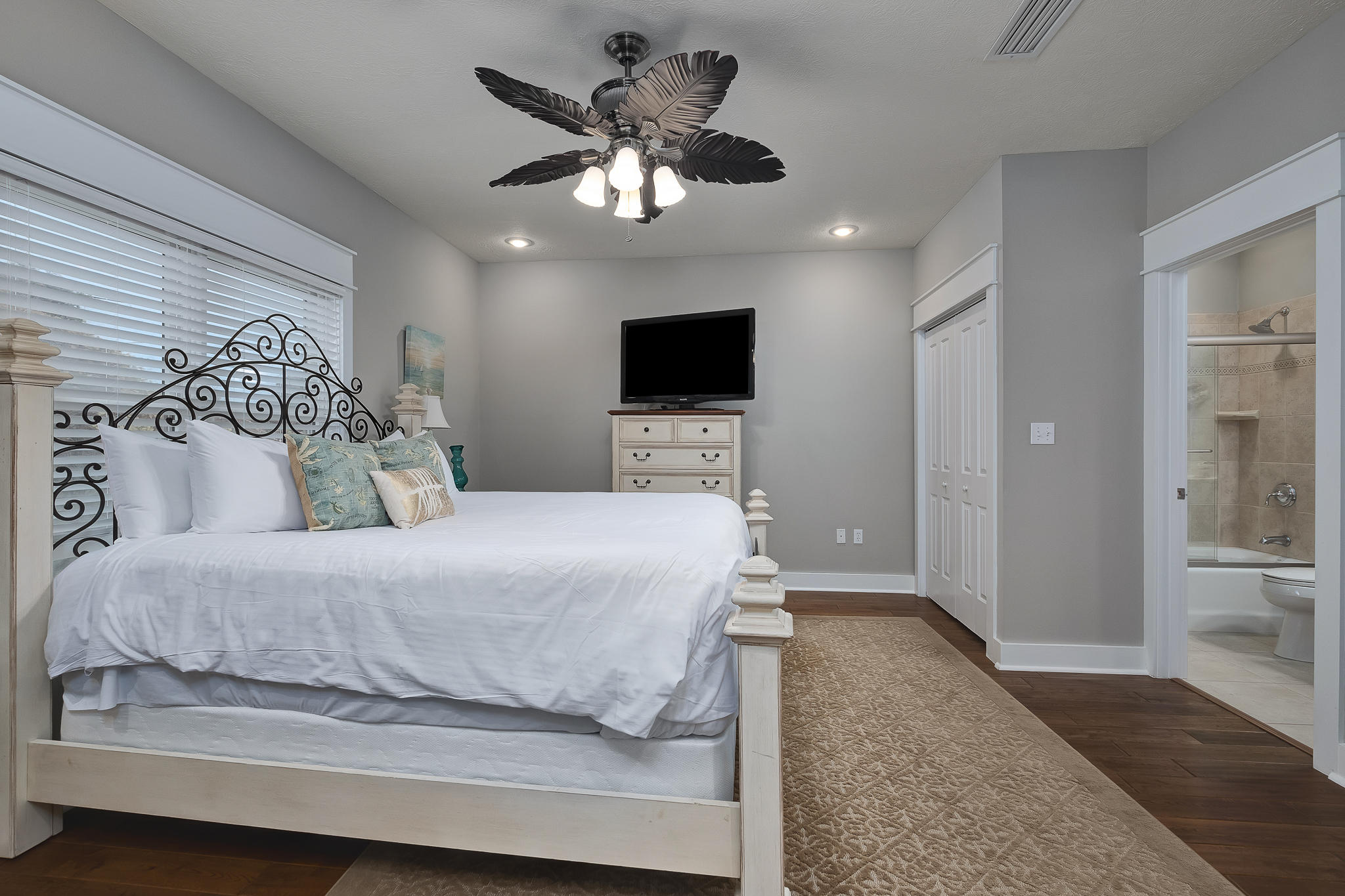 8968 East County Highway 30A Inlet Beach, FL 32461 - Photo 8 of 46 a spacious bedroom with a bed and a flat screen tv
