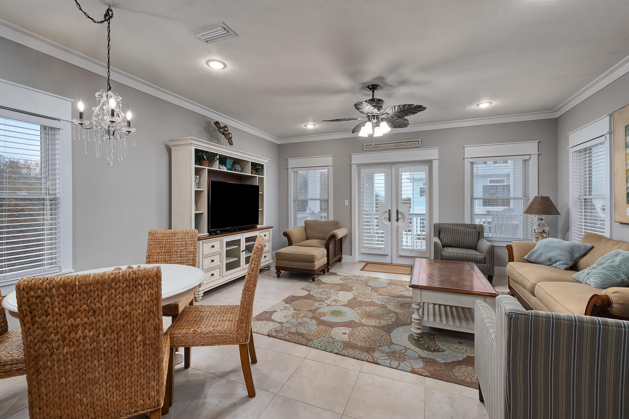 8968 East County Highway 30A Inlet Beach, FL 32461 - Photo 10 of 46 a living room with furniture a chandelier and a flat screen tv
