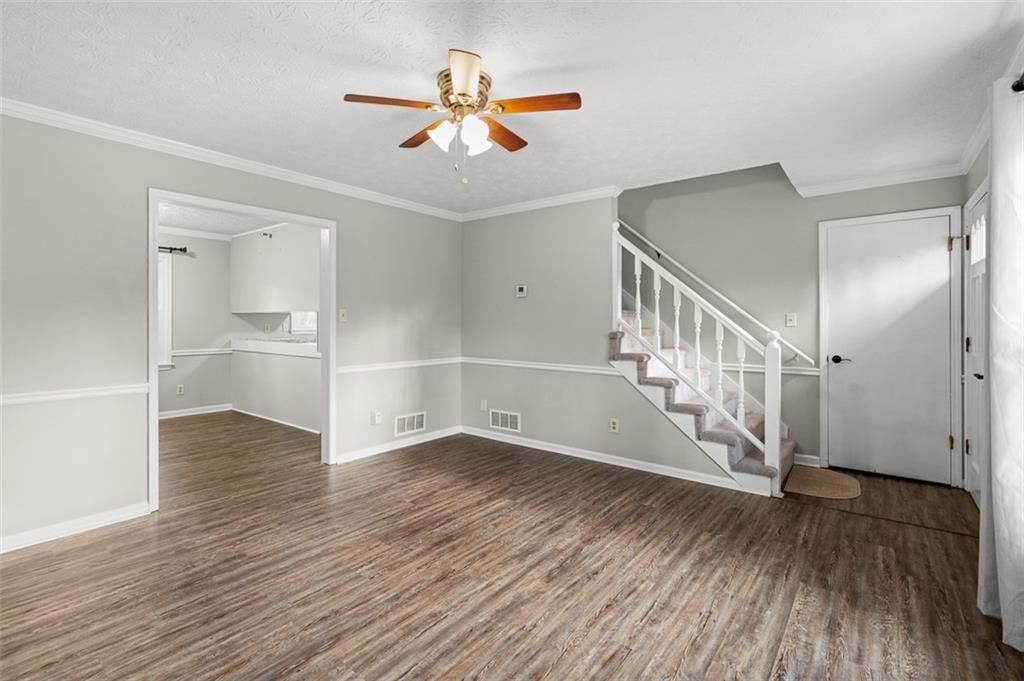 474 Daisy Trail Lawrenceville, GA 30046 - Photo 13 of 41 wooden floor in an empty room with a window