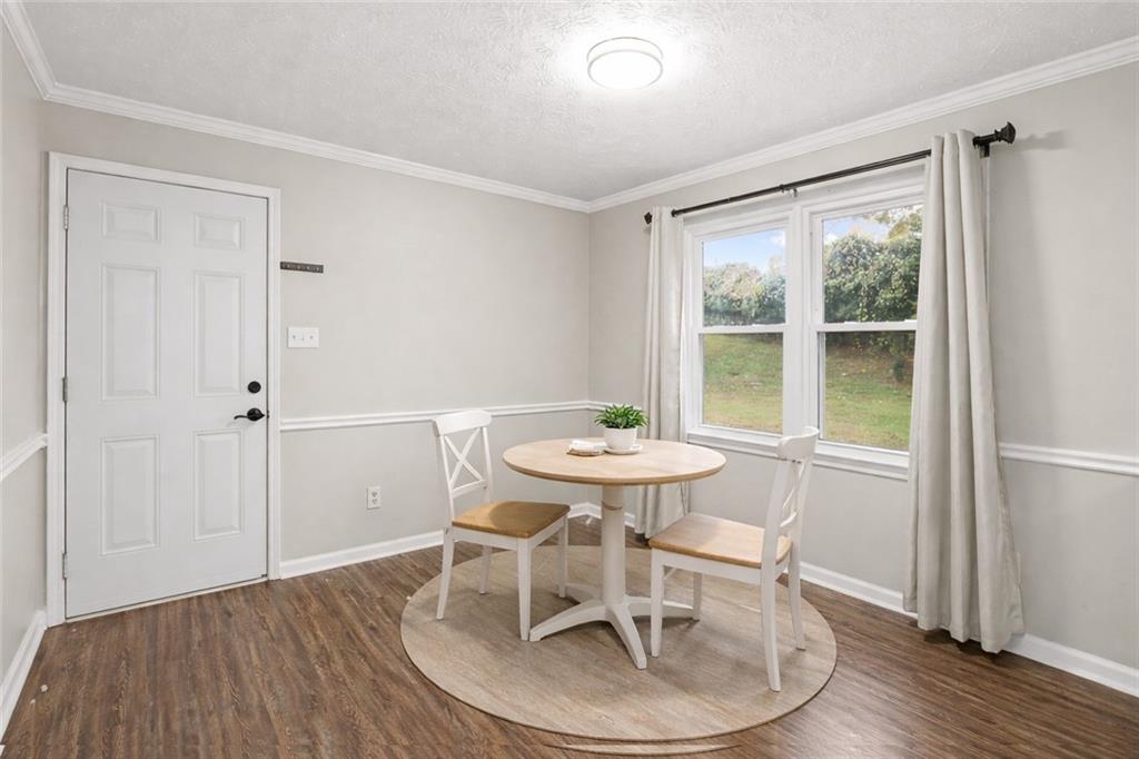 474 Daisy Trail Lawrenceville, GA 30046 - Photo 18 of 41 a view of a dining room with furniture window and wooden floor