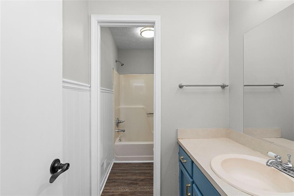474 Daisy Trail Lawrenceville, GA 30046 - Photo 23 of 41 a bathroom with a sink and mirror