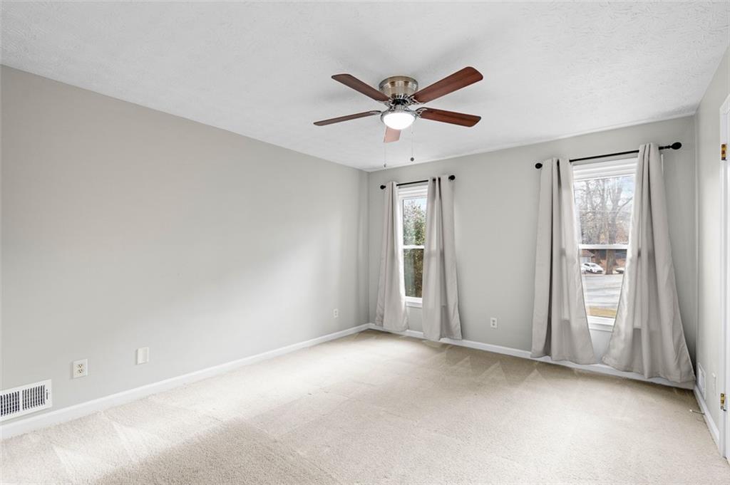 474 Daisy Trail Lawrenceville, GA 30046 - Photo 24 of 41 a view of a livingroom with a ceiling fan and window