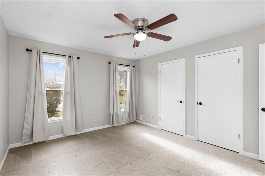 474 Daisy Trail Lawrenceville, GA 30046 - Photo 25 of 41 a view of an empty room with a ceiling fan