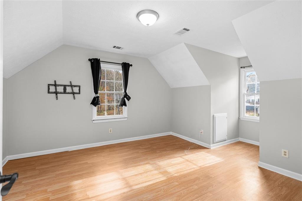 474 Daisy Trail Lawrenceville, GA 30046 - Photo 27 of 41 wooden floor in an empty room with a window