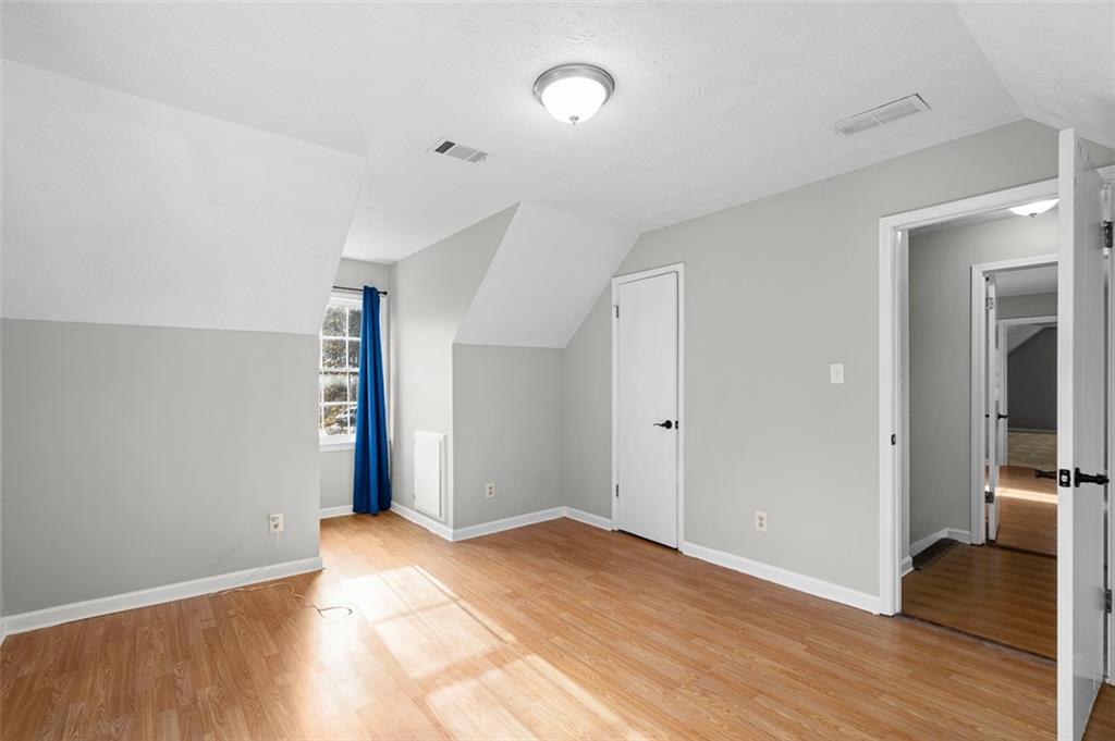 474 Daisy Trail Lawrenceville, GA 30046 - Photo 29 of 41 a view of empty room with wooden floor