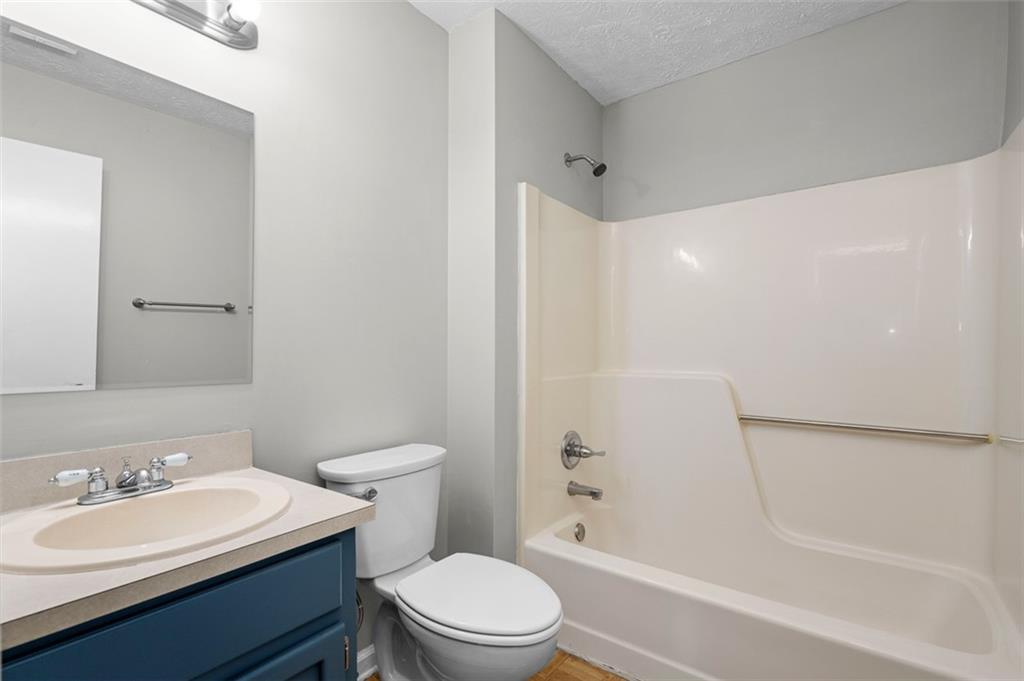 474 Daisy Trail Lawrenceville, GA 30046 - Photo 30 of 41 a bathroom with a sink a toilet and shower