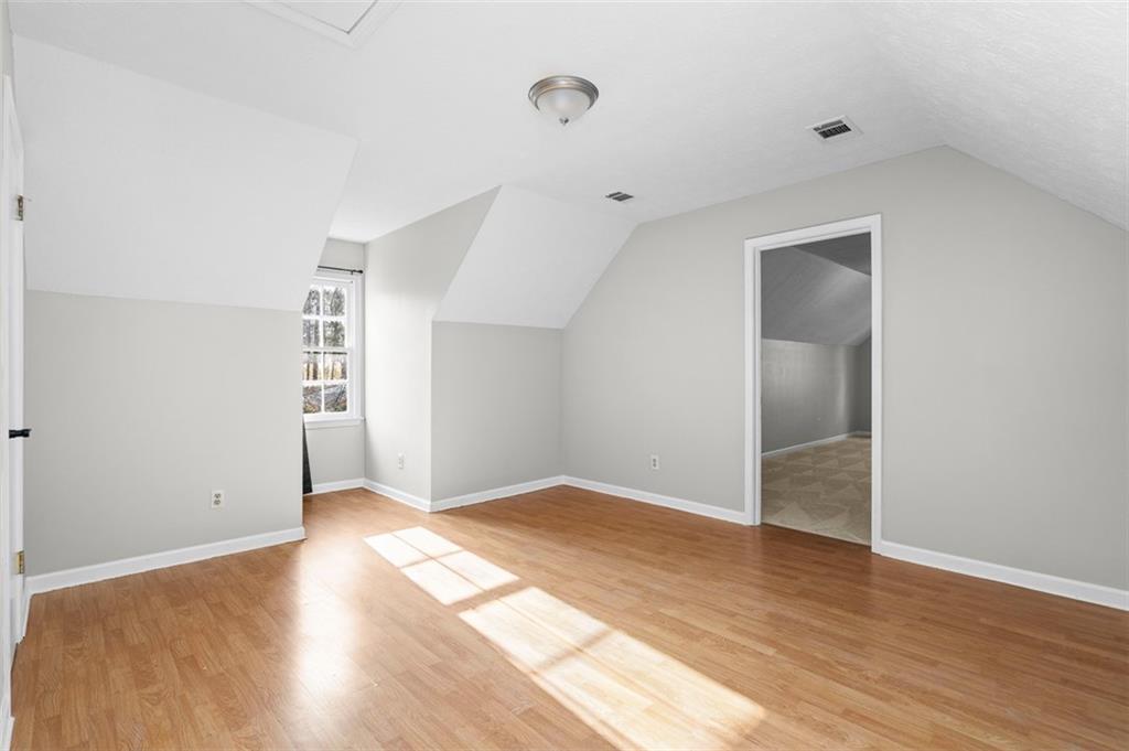 474 Daisy Trail Lawrenceville, GA 30046 - Photo 31 of 41 an empty room with wooden floor & windows