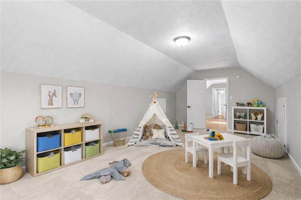 474 Daisy Trail Lawrenceville, GA 30046 - Photo 35 of 41 a living room with furniture and a wooden floor