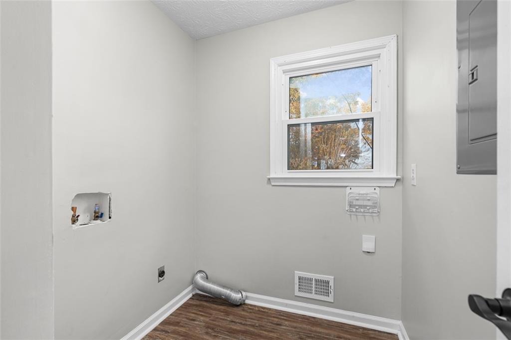 474 Daisy Trail Lawrenceville, GA 30046 - Photo 36 of 41 a view of an empty room with wooden floor and a window