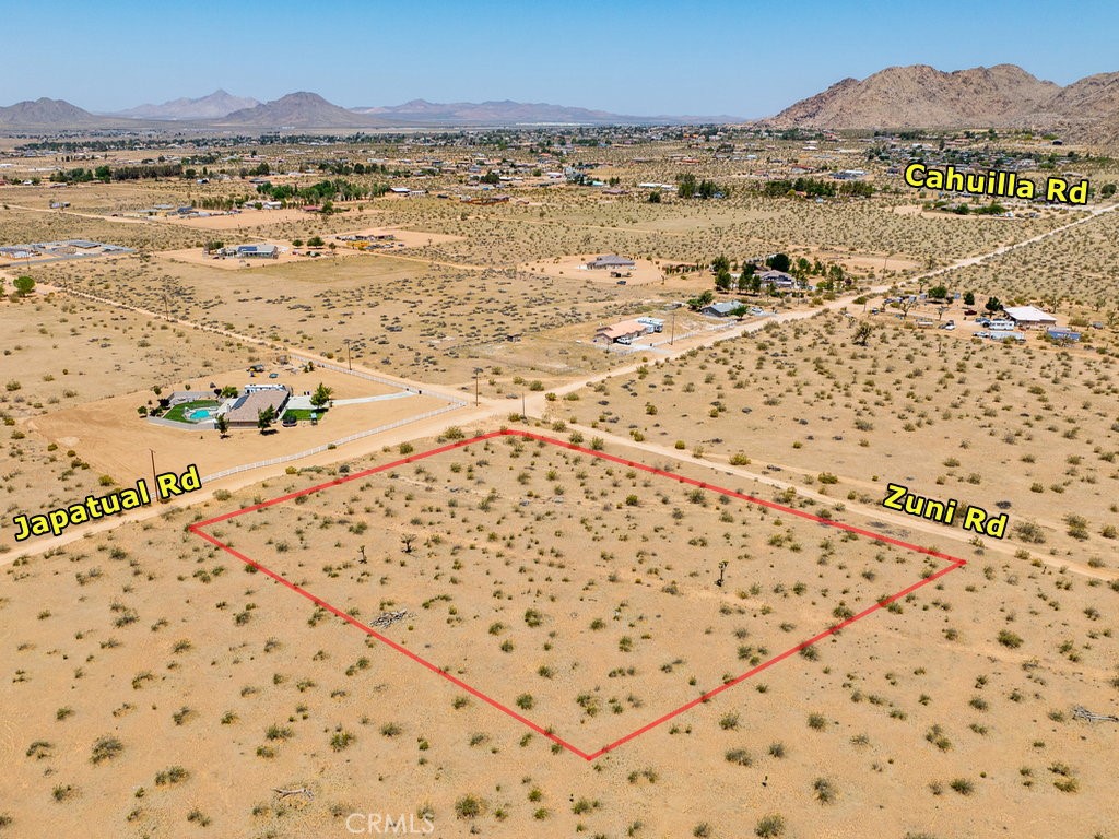 24127 Zuni Road Apple Valley, CA 92307 - Photo 1 of 1 a view of an ocean beach and mountain