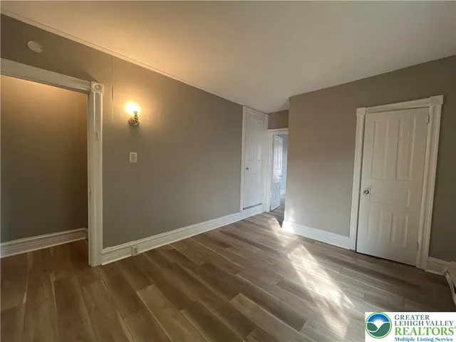 a view of an empty room and window