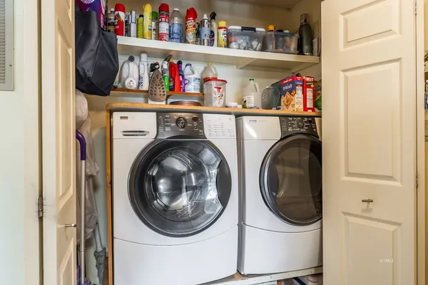 a bedroom with furniture and a bed