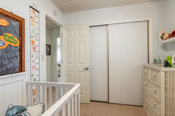a bathroom with a granite countertop sink toilet and a mirror