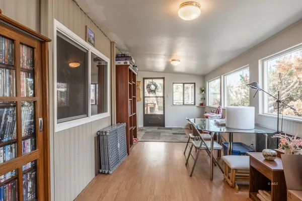 a view of a livingroom with furniture and front door