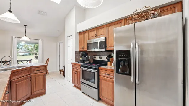 a kitchen with a stove and a white cabinets