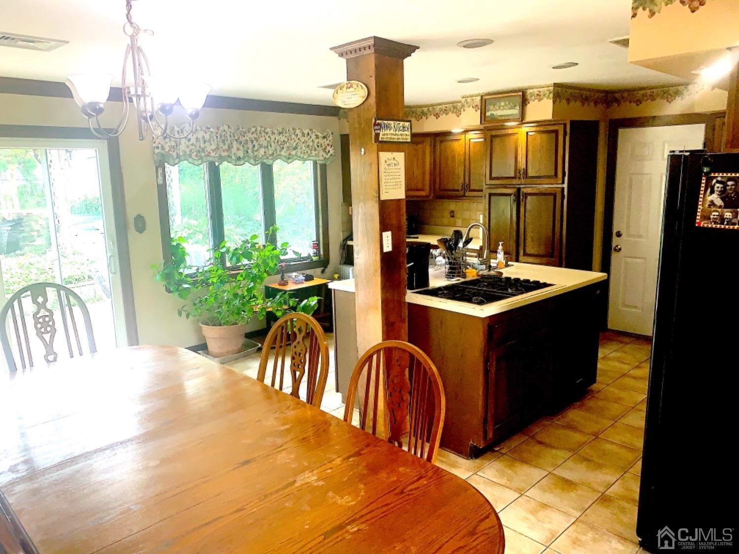 191 Oxford Road Colonia, NJ 07067 - Photo 13 of 23 a kitchen with sink a refrigerator and furniture