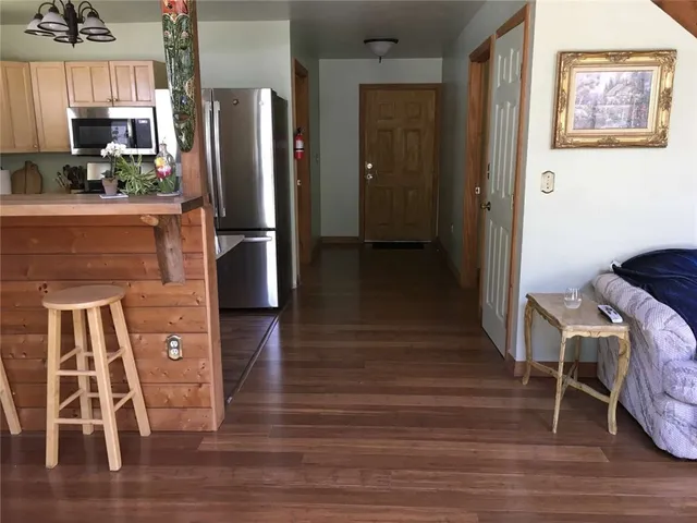 a kitchen with stainless steel appliances granite countertop a refrigerator and a stove