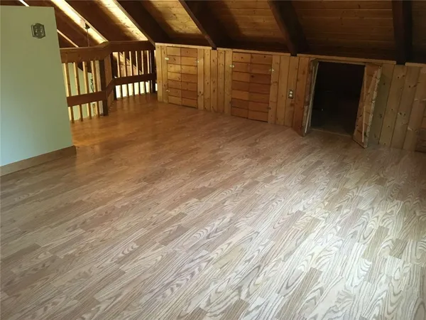 a living room with furniture window and wooden floor