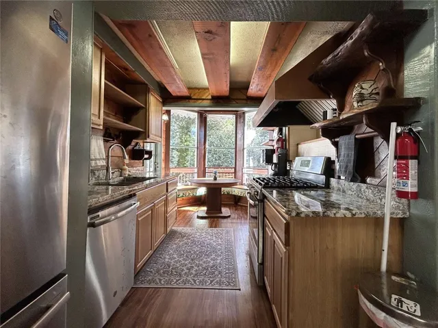 a kitchen with stainless steel appliances granite countertop lots of counter top space