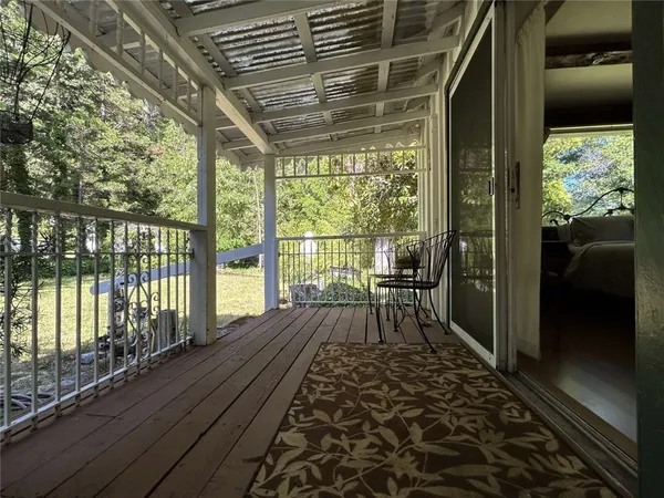 a view of balcony with wooden floor