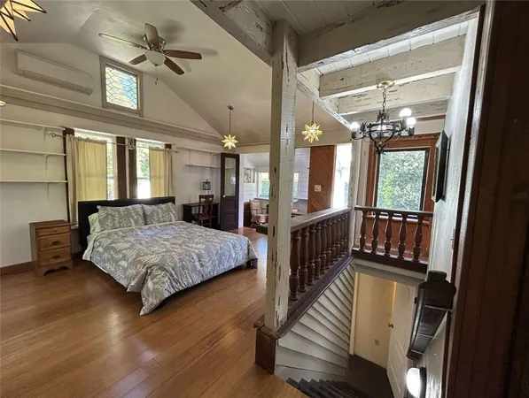 a bedroom with furniture and window