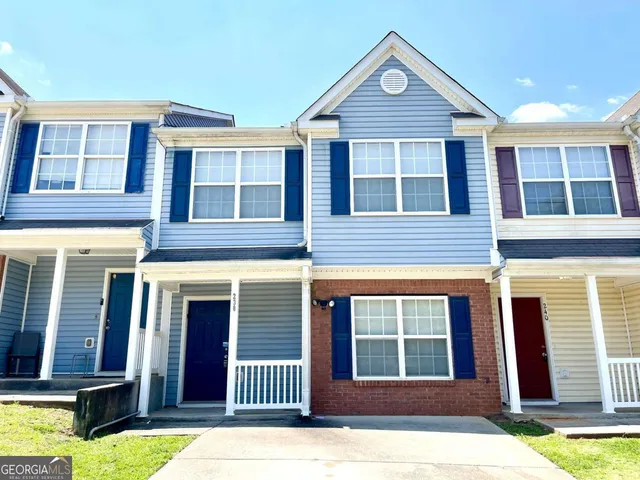 a front view of a house having yard