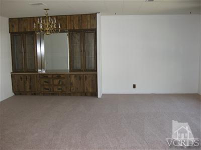 6480 Katherine Road, Unit 61 Simi Valley, CA 93063 - Photo 5 of 7 a view of a storage & utility room with wooden floor